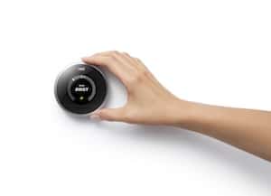 nest_thermostat_with_hand